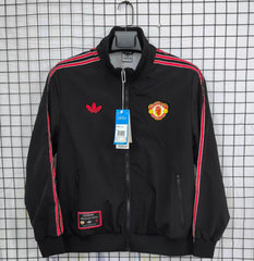 Black Man united jacket with red stripes featuring Adidas and Manchester United logos on a checkered background
