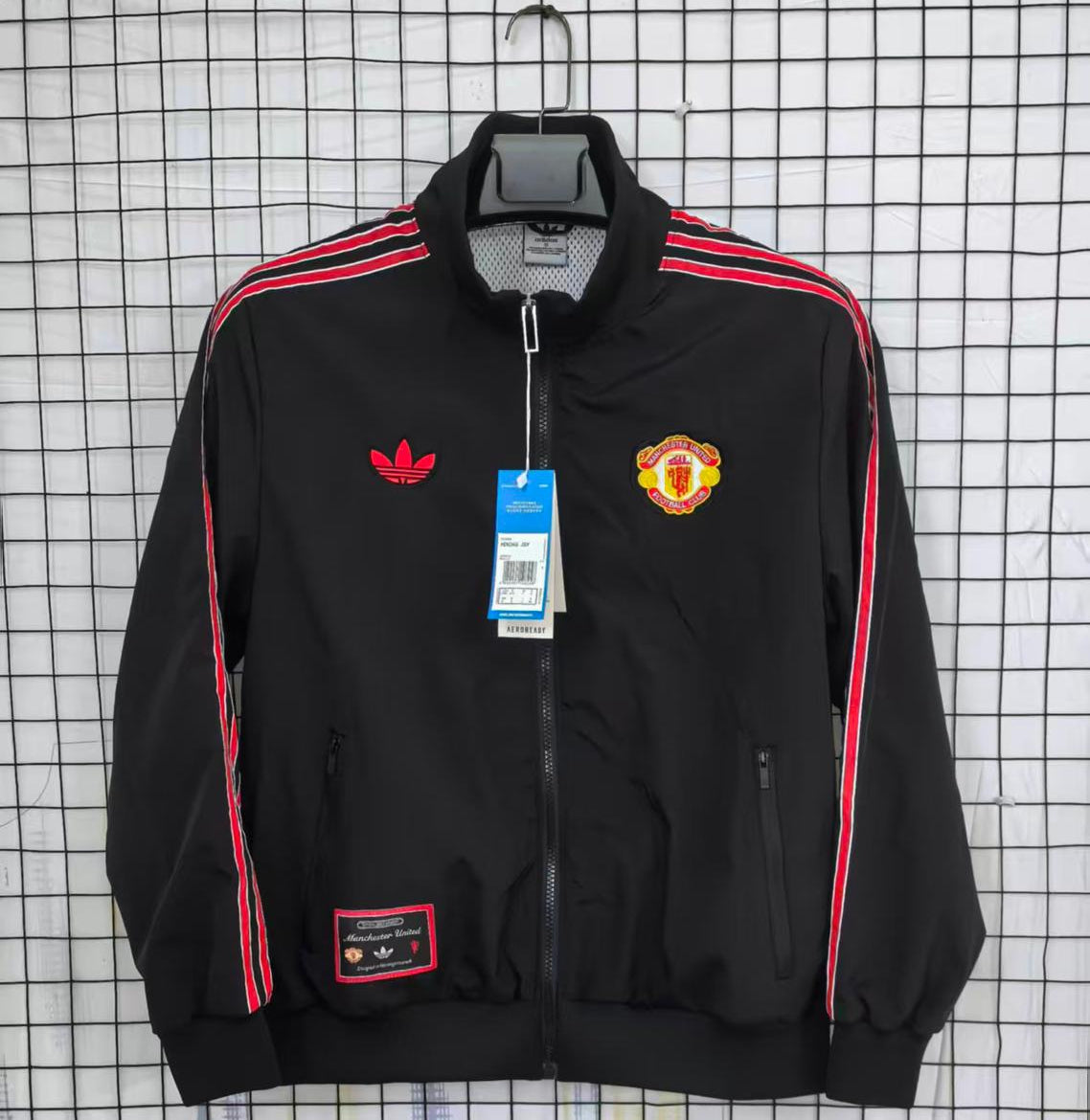 Black Man united jacket with red stripes featuring Adidas and Manchester United logos on a checkered background