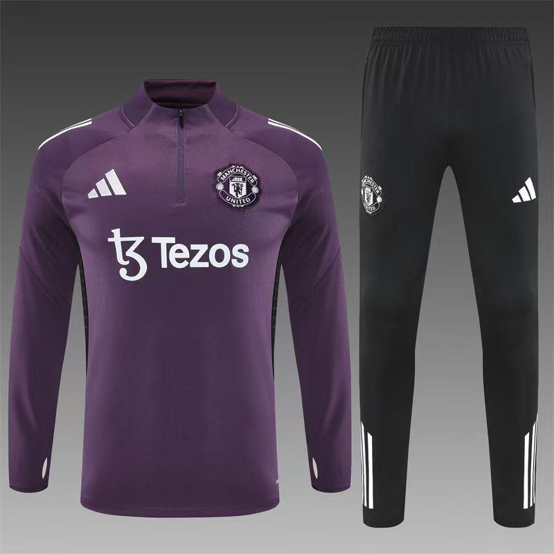 Manchester United sports jacket and black pants with Adidas and Tezos branding on a gray background